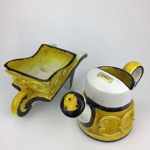 Ceramic yellow brown watering can wheelbarrow art